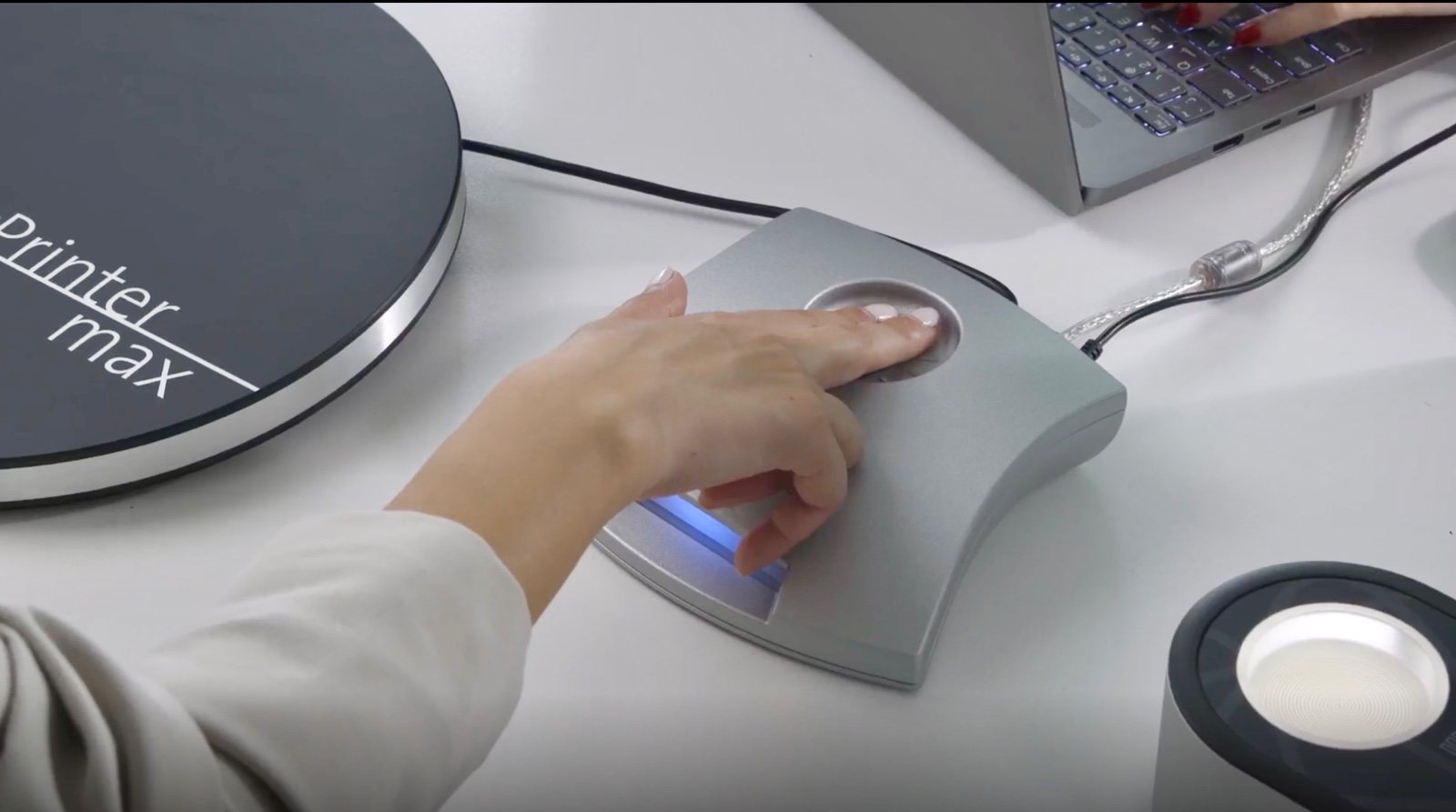 Guest resting a hand on the Qbit quantum response scanner